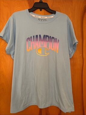 Champion Light Blue Tee with Purple-to-Yellow Gradient Logo